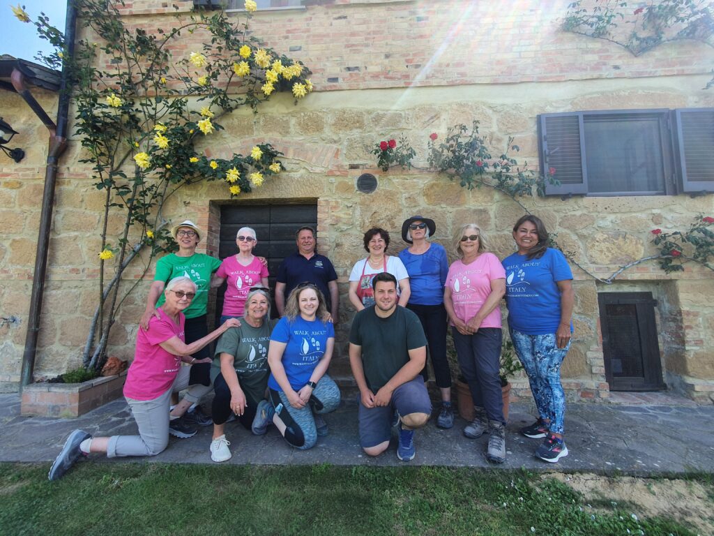 The group with the owners at Podere Santa Maria family farm in the countryside near Pienza, Tuscany