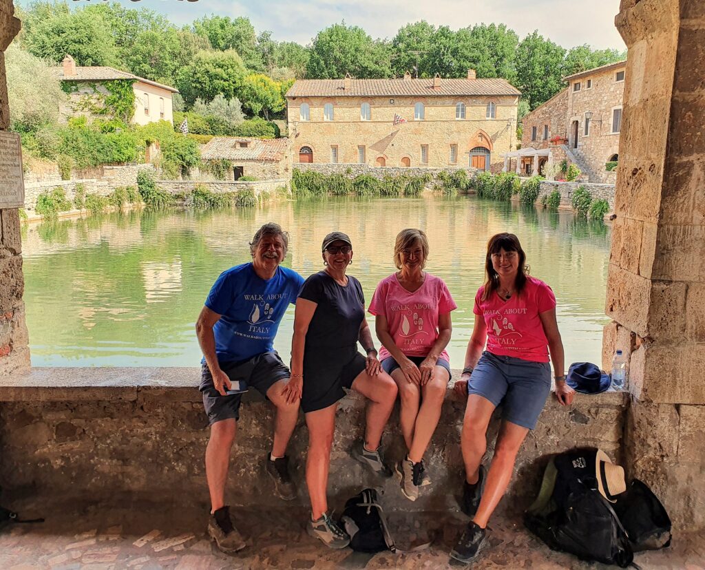 Bagno Vignoni hot springs in Tuscany with clients