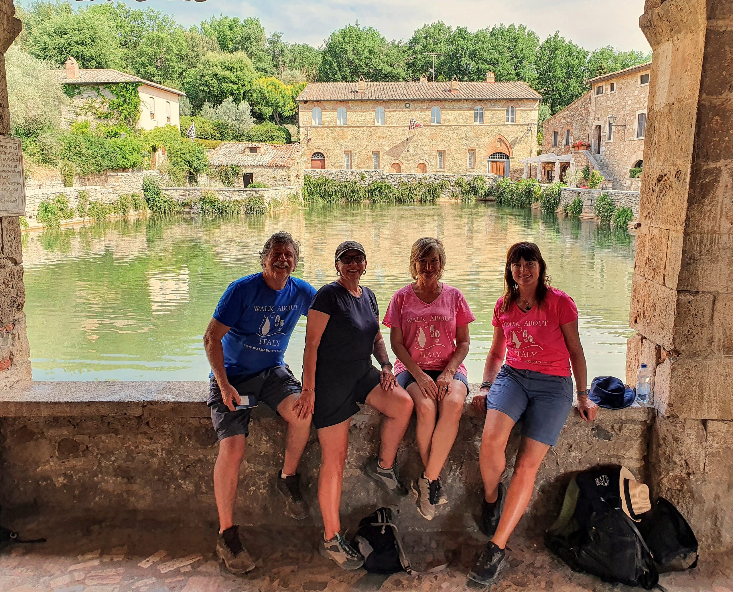Bagno Vignoni hot springs in Tuscany with clients