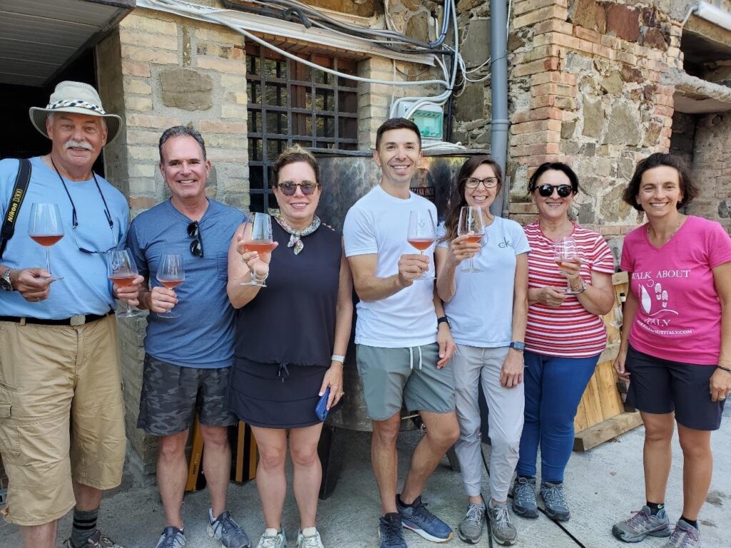 Our group enjoying a glass of Giacomo's rosé (Iconic Tuscany walking tour with Walk About Italy)